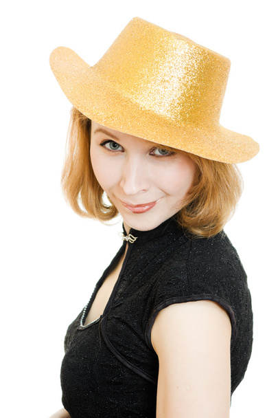 Beautiful woman in a gold hat on a white background. - Fotó, kép