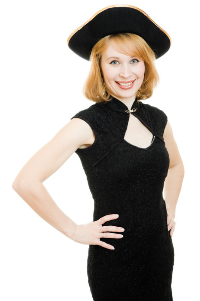 A beautiful woman in a black pirate hat on a white background. - Foto, Bild