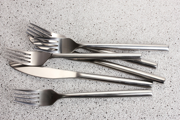 Forks and knives on marble table - Fotografie, Obrázek