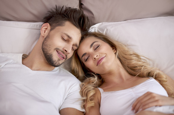 Couple napping in the bedroom - Photo, Image