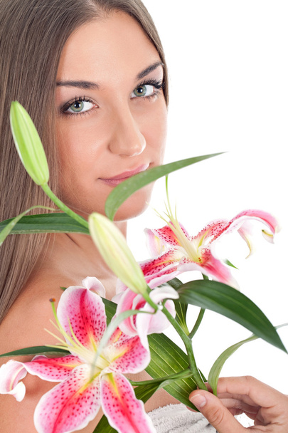 Beautiful woman's face with flowers - Zdjęcie, obraz