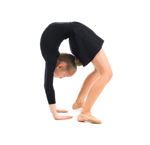 little gymnast stretching on the floor - Photo, Image