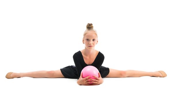 little gymnast doing exercise with ball - Фото, изображение