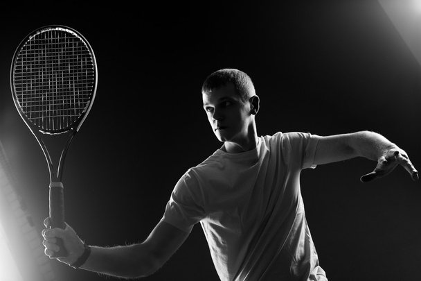 Tennis player on black background. Studio shot - Foto, Imagem