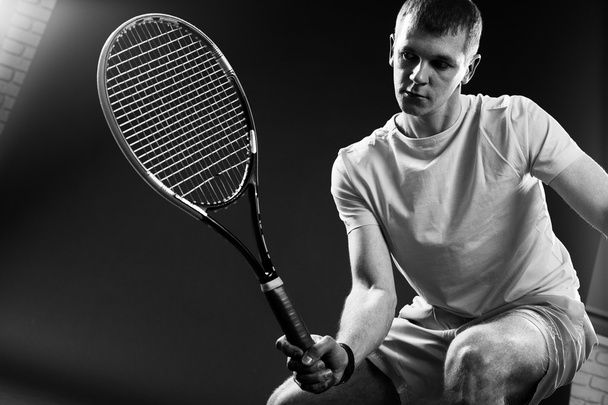 Tennis player on black background. Studio shot - Foto, Imagem