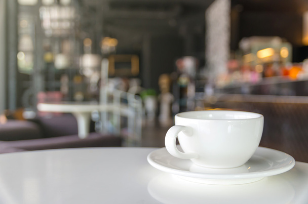 Coffee cup on coffee shop blur background - Photo, Image