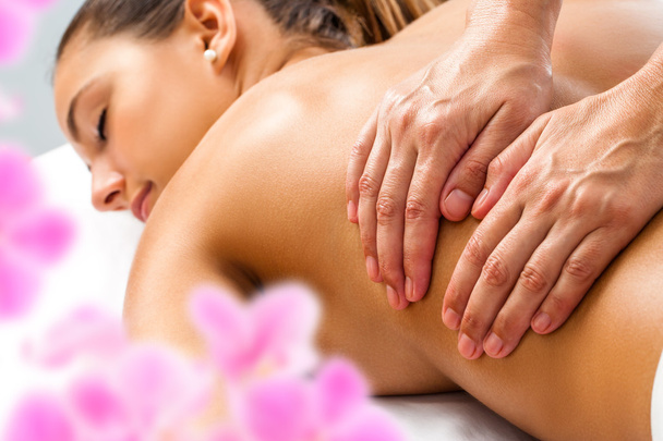 Hands doing Relaxing back massage. - Photo, Image