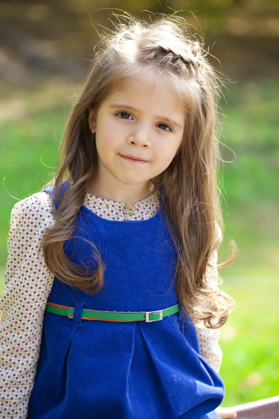 Close up portrait of a six year little girl, against background - Fotografie, Obrázek