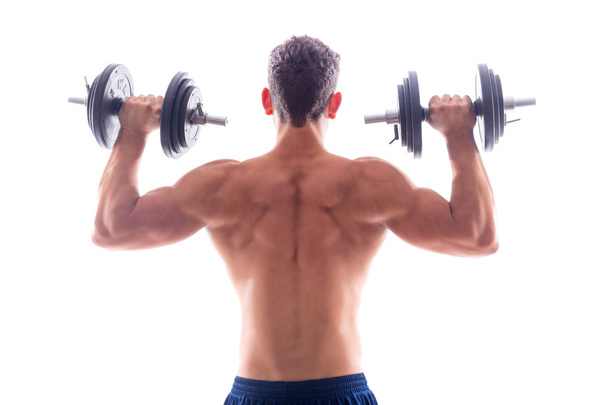 Portrait of a muscular man lifting weights - Zdjęcie, obraz