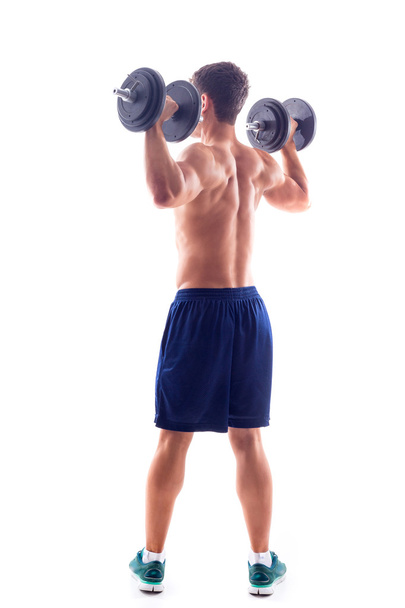 Muotokuva lihaksikas mies nostaa painoja
 - Valokuva, kuva