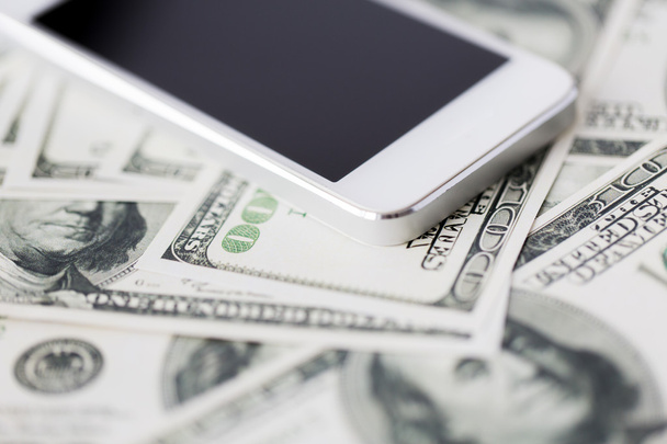 close up of smartphone and dollar money - Foto, imagen