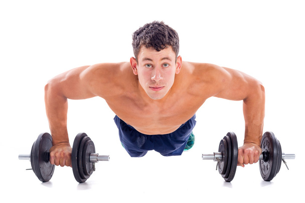 Portrait of a muscular man lifting weights - Photo, image