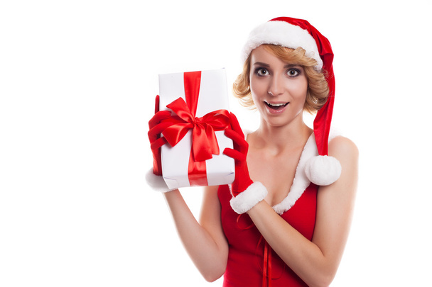 Picture of cheerful santa helper  blond girl with gift box - Фото, зображення