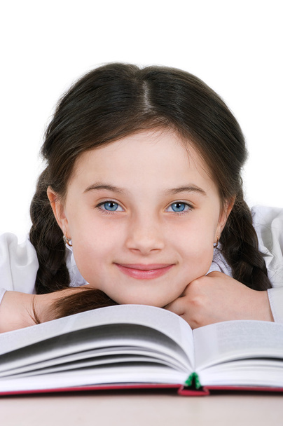 close-up portrait happy little girl child with a book on a white - Zdjęcie, obraz