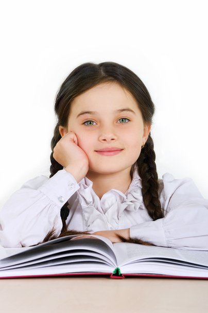 happy little girl child with a book on a white background - Foto, imagen