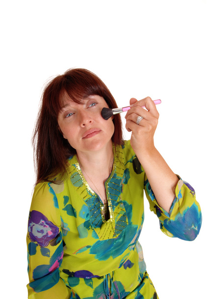 Woman putting on makeup. - Photo, Image