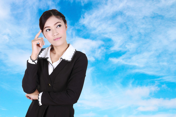 Business woman thinking with blue sky - Fotografie, Obrázek
