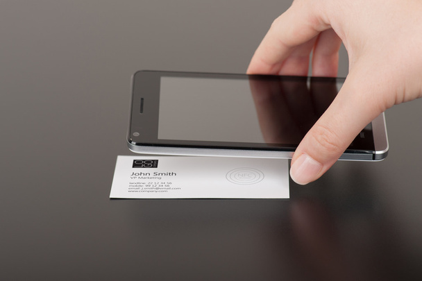 Business card with embedded NFC tag and phone - Photo, Image