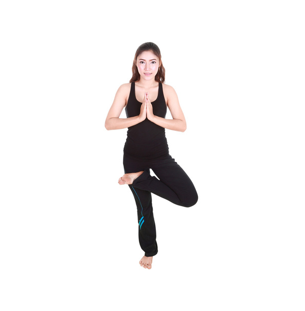 Young woman doing yoga exercise - Valokuva, kuva