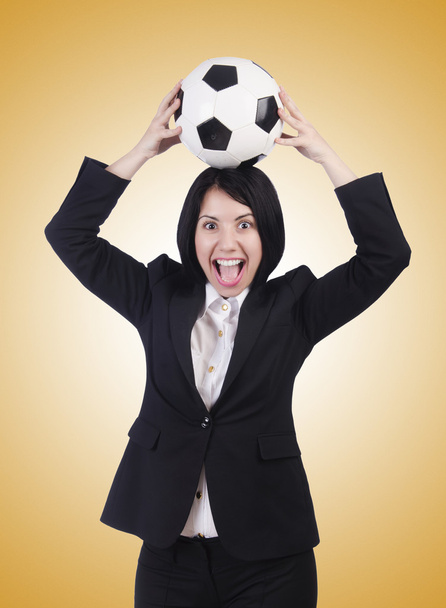 Businesswoman with ball on brown - Zdjęcie, obraz