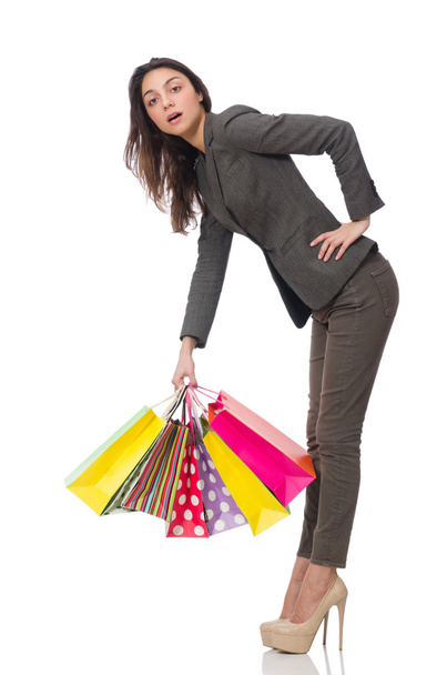 Attraktive Frau mit Einkaufstaschen auf weißem Grund - Foto, Bild