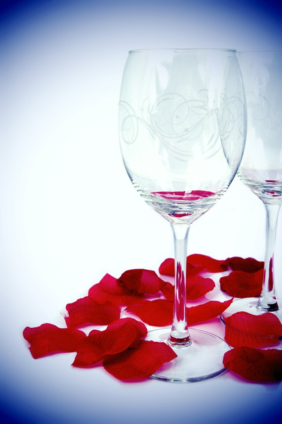 Glasses and rose petals composition - 写真・画像