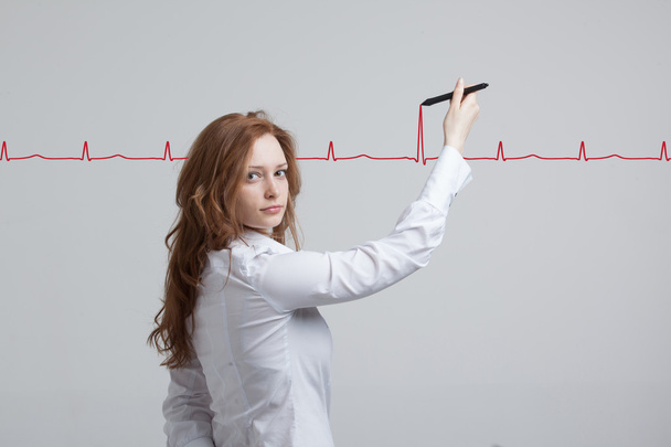 doctor woman drawing cardiogram - Photo, Image