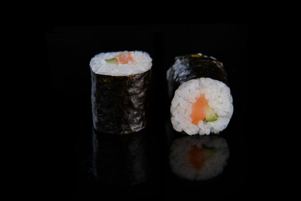 Sushi rolls on black background - Foto, immagini