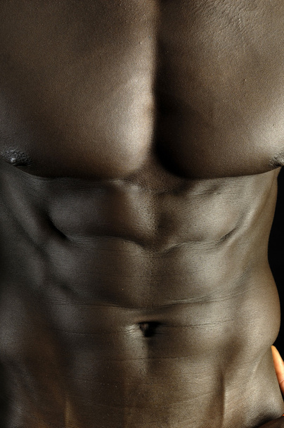 Un hombre negro con un cuerpo musculoso
, - Foto, Imagen