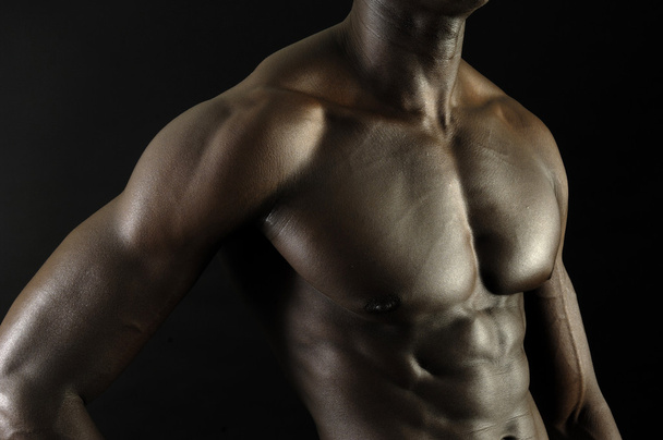 A black man with a muscular body - Photo, Image
