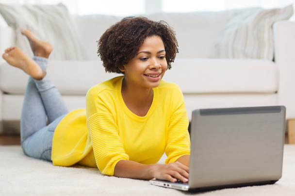happy african american woman with laptop at home - Photo, Image