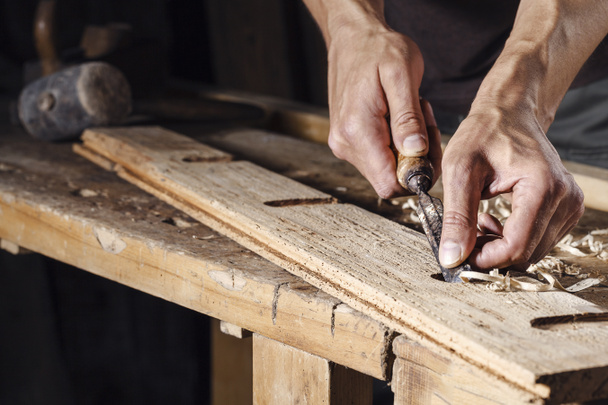 carpenter hands working with a chisel and carving tools - Photo, Image