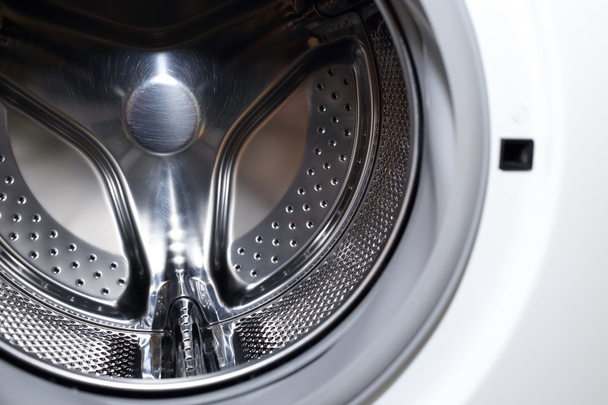 Close-up beeld van wassen machine, abstracte metalen textuur - Foto, afbeelding