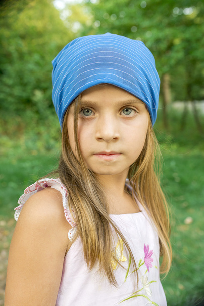 portrait of a girl in a blue hat - Photo, image