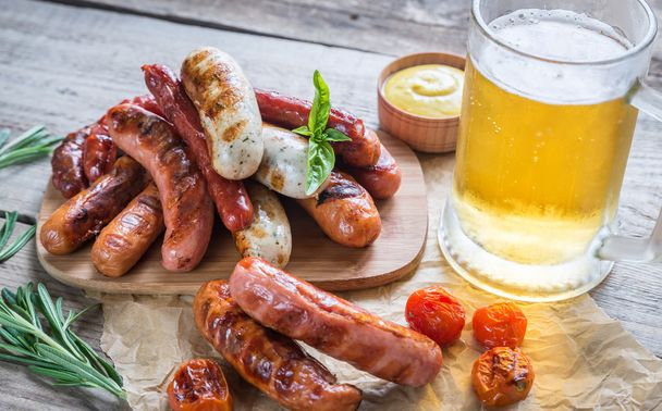 Grilled sausages with glass of beer - Photo, Image