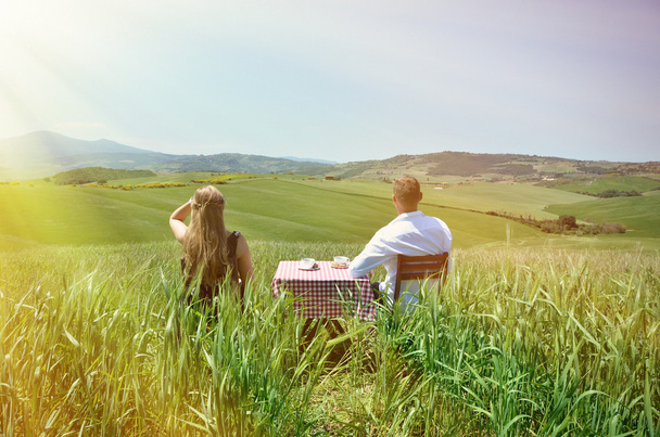 couple at  Tuscan field. - Photo, Image