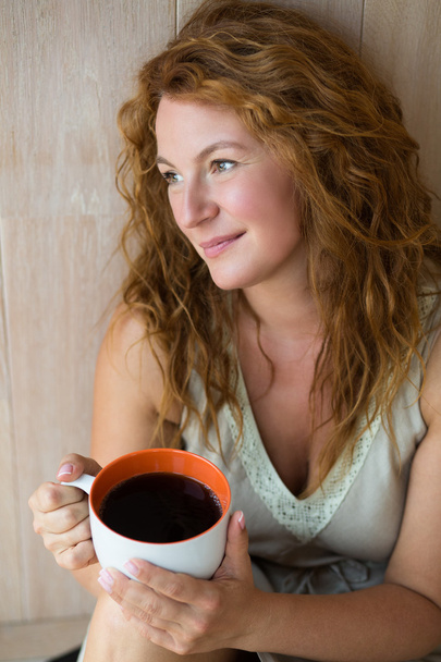 Portrait of pretty mature woman with cup of tea - Zdjęcie, obraz