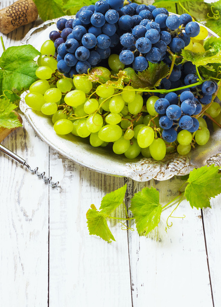Grapes on a wooden table - Фото, изображение