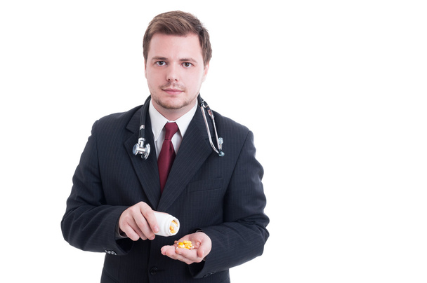 Elegantní lékař nebo obchodník drží prášky - Fotografie, Obrázek