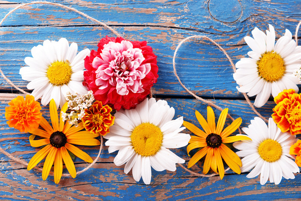 Fresh colorful flowers on wooden table, closeup - Φωτογραφία, εικόνα