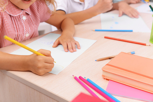 Group of children drawing at the desk, closeup - 写真・画像