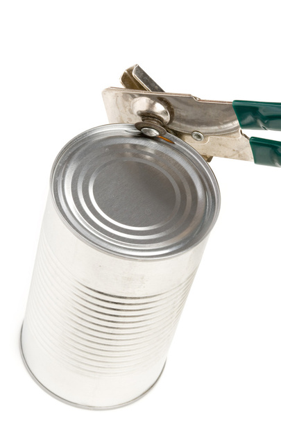 Premium Photo  Old can opener and tin can with food on a white background  closeup