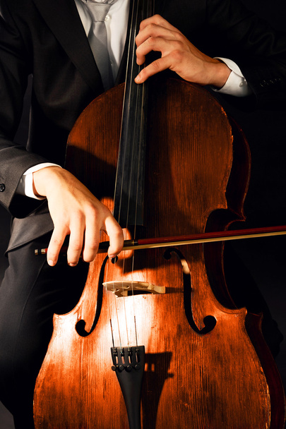 Man playing on cello close up - 写真・画像