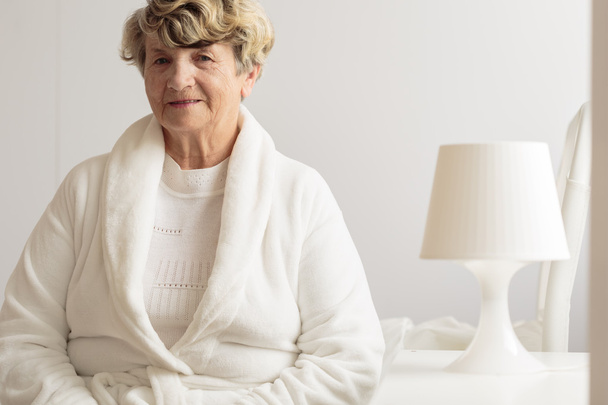 Senior woman in dressing gown - Photo, Image