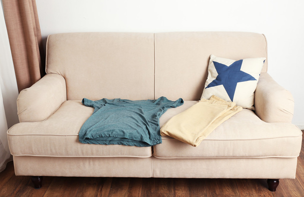Male clothing on sofa in room - Photo, Image