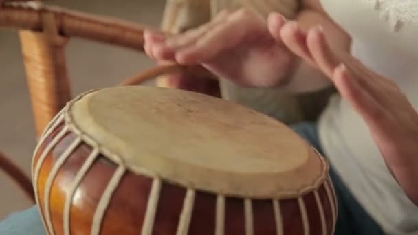 Woman banging a bongo - Footage, Video