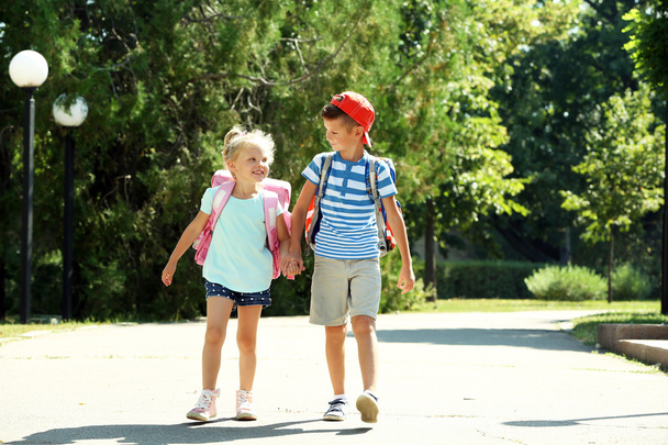 Happy active children with bags outdoors - Foto, afbeelding