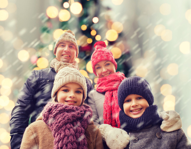 happy family in winter clothes outdoors - Фото, изображение