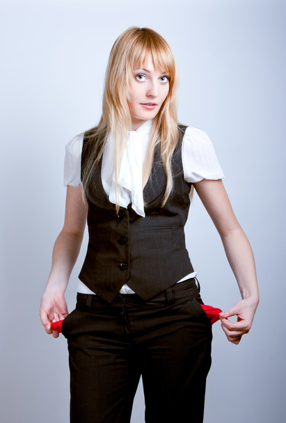 Young business woman showing empty pockets - Fotografie, Obrázek
