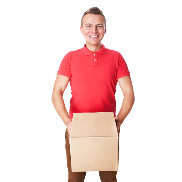 Happy smiling delivery man carrying boxes - Foto, Bild